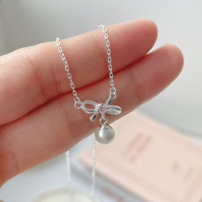 Cady Bow and Pearl Necklace