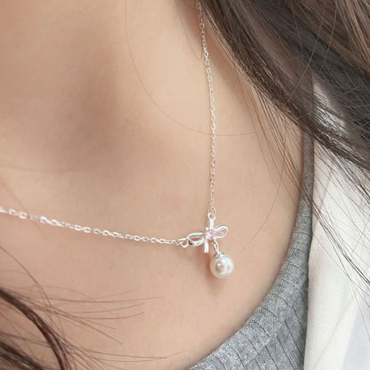 Cady Bow and Pearl Necklace