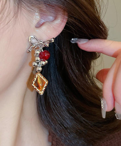 Acrylic Alloy Asymmetrical Amber Bow Tassel Drop Earrings