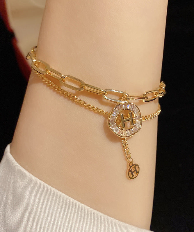 Gold Alloy Crystal Graphic Tassel Charm Bracelet