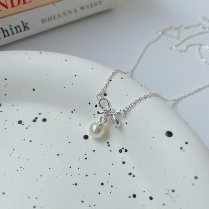 Cady Bow and Pearl Necklace