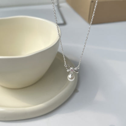 Cady Bow and Pearl Necklace